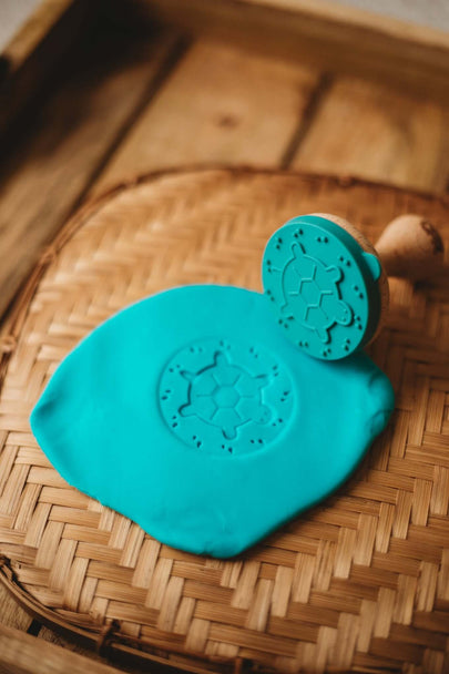 Under the Sea stamp designs imprinted in green playdough