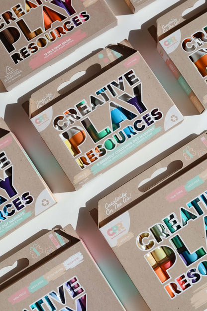 Multiple boxes of 'Creative Play Resources' with colorful text on a white background