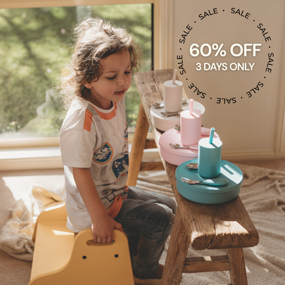 A child sits on a yellow stool in a sunlit room while playing with pastel-colored toy utensils and cups on a wooden table. A large sale overlay reads '60% OFF 3 DAYS ONLY'.