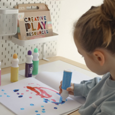 Child playing with dot markers from Creative Play Resources 