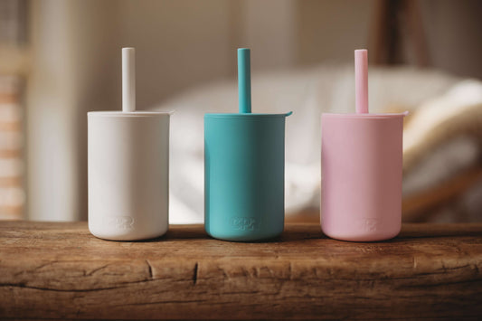 silicone sippy cup with straw in white, blue and pink