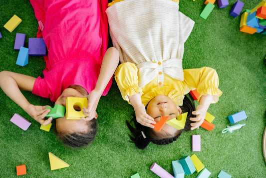 A young children playing with building blocks stimulating their imagination