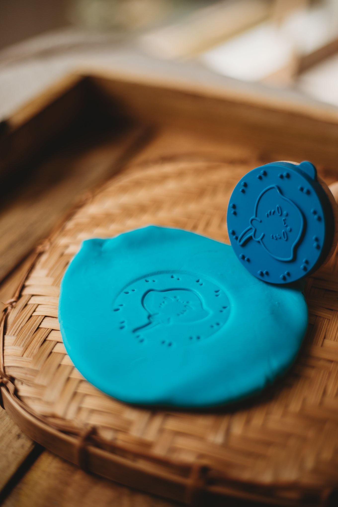 Blue play dough with a stingray stamper