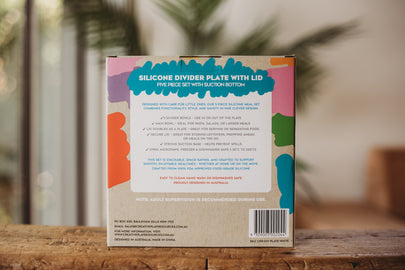Silicone divider plate packaging with colorful design on a wooden surface
