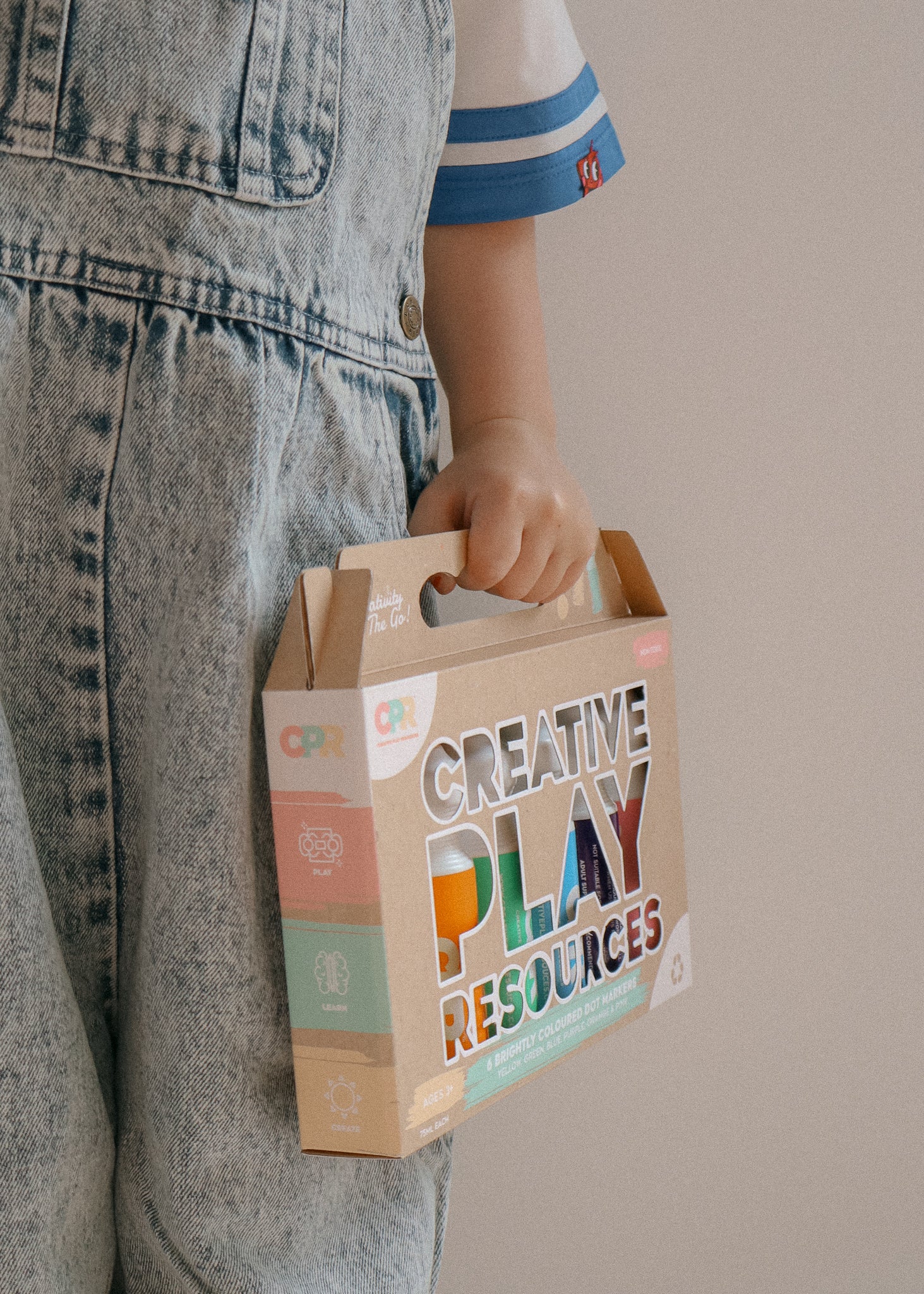 child holding unique box of 6 chunky dot markers. Ideal gift for kids. 