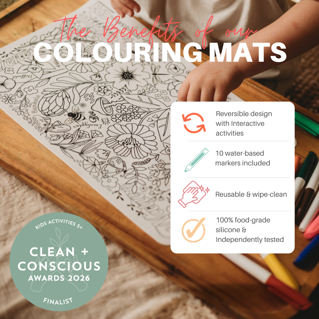 A promotional graphic for a children's colouring mat showing a hand coloring a black-and-white floral design on a wooden table. Large text reads 'The Benefits of our COLOURING MATS,' with feature callouts in a white box and a 'Clean + Conscious Awards 2026 Finalist' badge.
