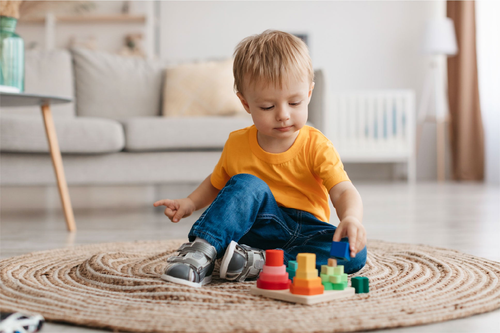 Child playing with wooden shapes