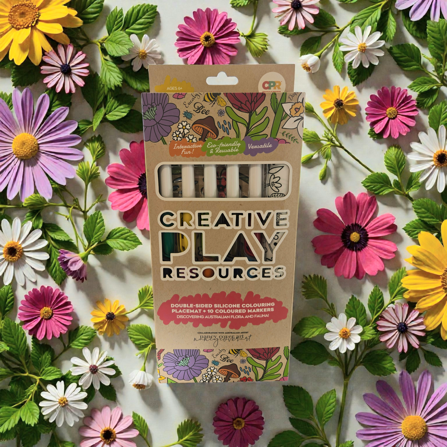 Packaging of Creative Play Resources on a background of colorful flowers